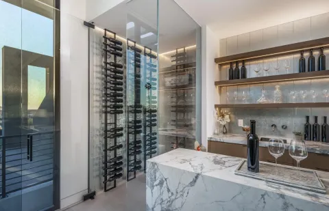 a bathroom with a granite countertop sink a mirror and shower