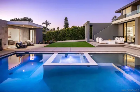 a view of a swimming pool with chairs