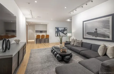 a living room with furniture and a flat screen tv