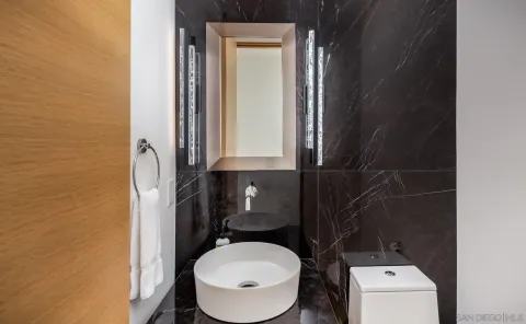 a bathroom with a toilet and a sink