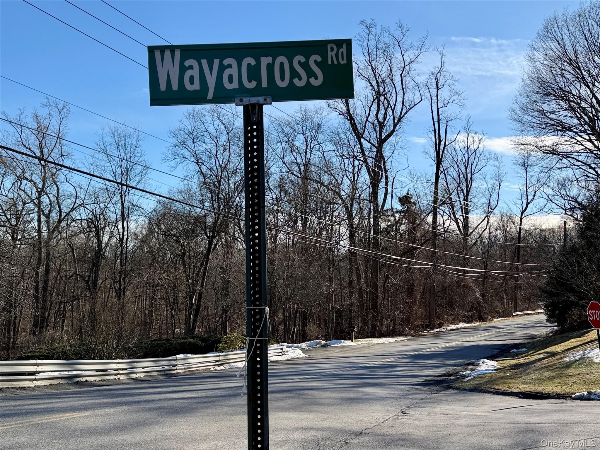 110 Wayacross Road Mahopac, NY 10541 - Photo 7 of 18 View of asphalt road featuring traffic signs and a forest view