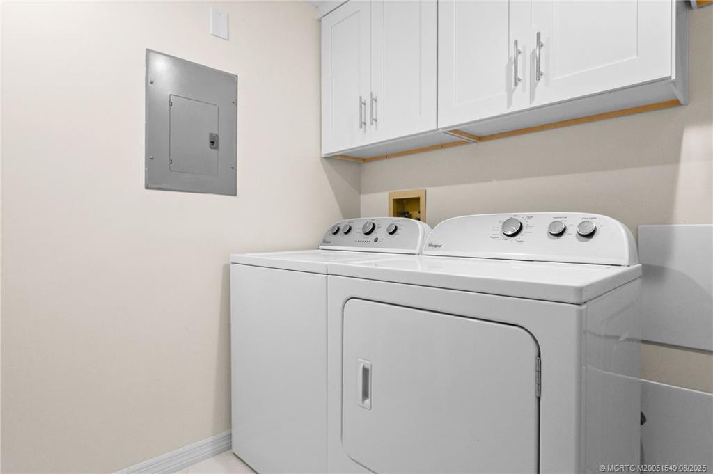 8650 South Ocean Drive, Unit 306 Jensen Beach, FL 34957 - Photo 38 of 51 a utility room with dryer and washer