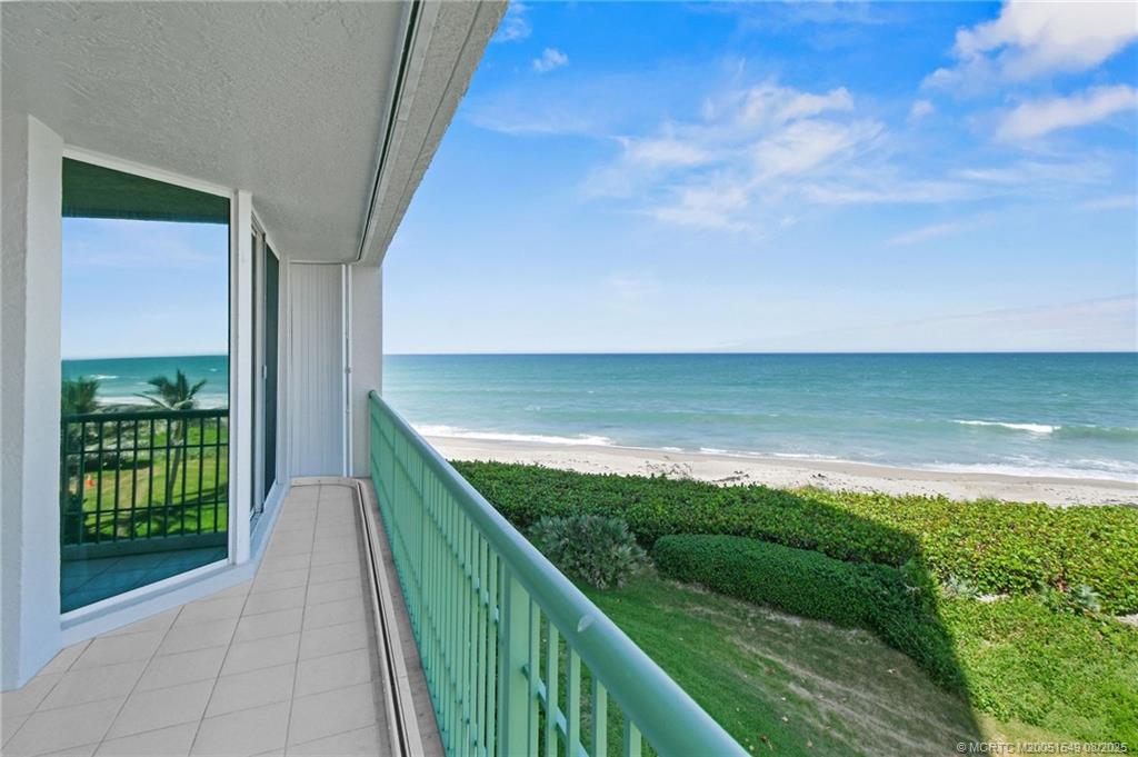 8650 South Ocean Drive, Unit 306 Jensen Beach, FL 34957 - Photo 40 of 51 a view of a balcony next to a yard