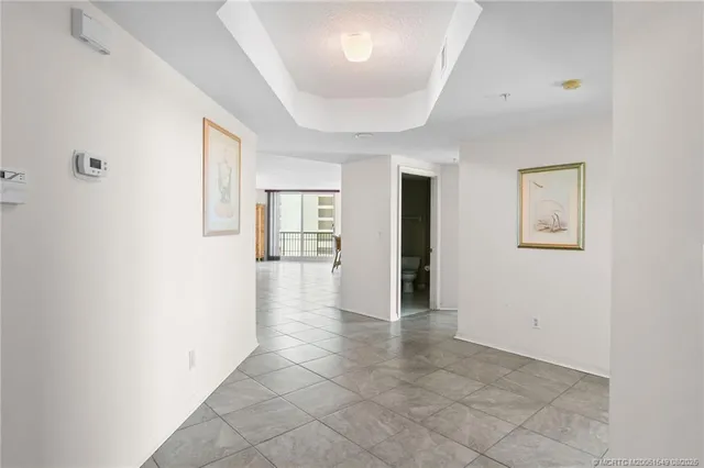 a bed room with furniture and a large window