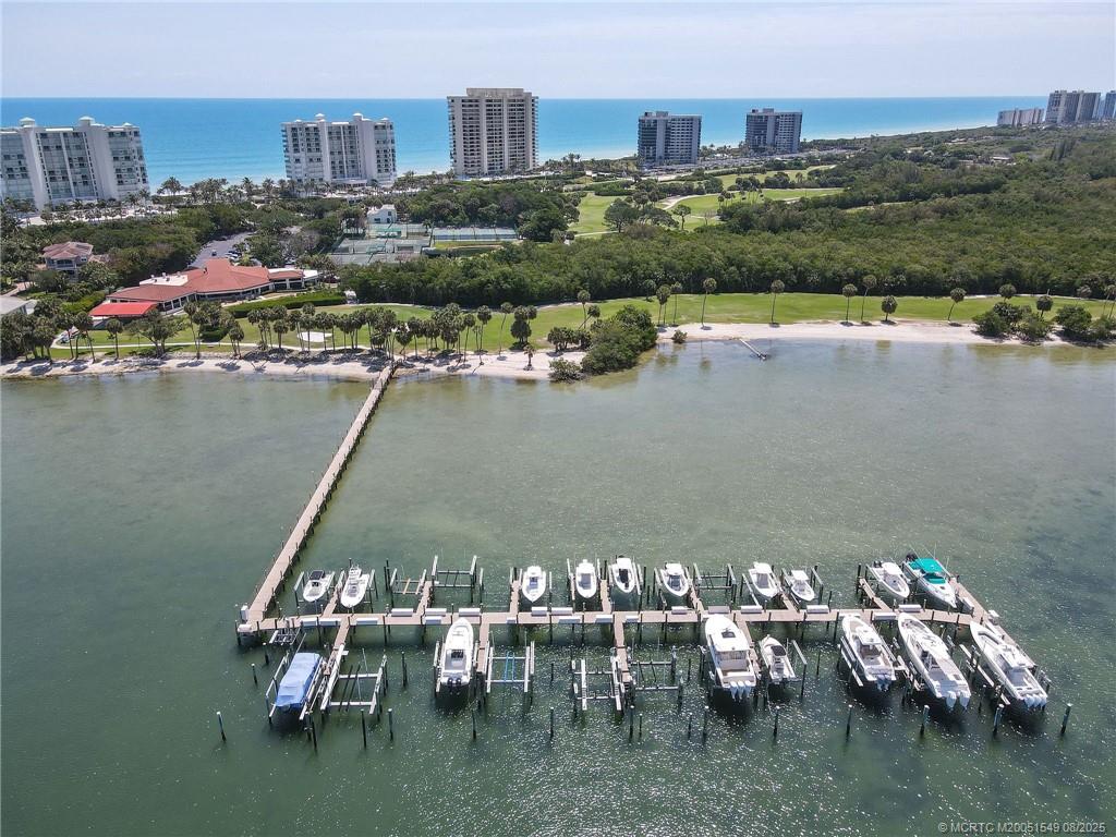 8650 South Ocean Drive, Unit 306 Jensen Beach, FL 34957 - Photo 46 of 51 a view of a lake with a table and chairs