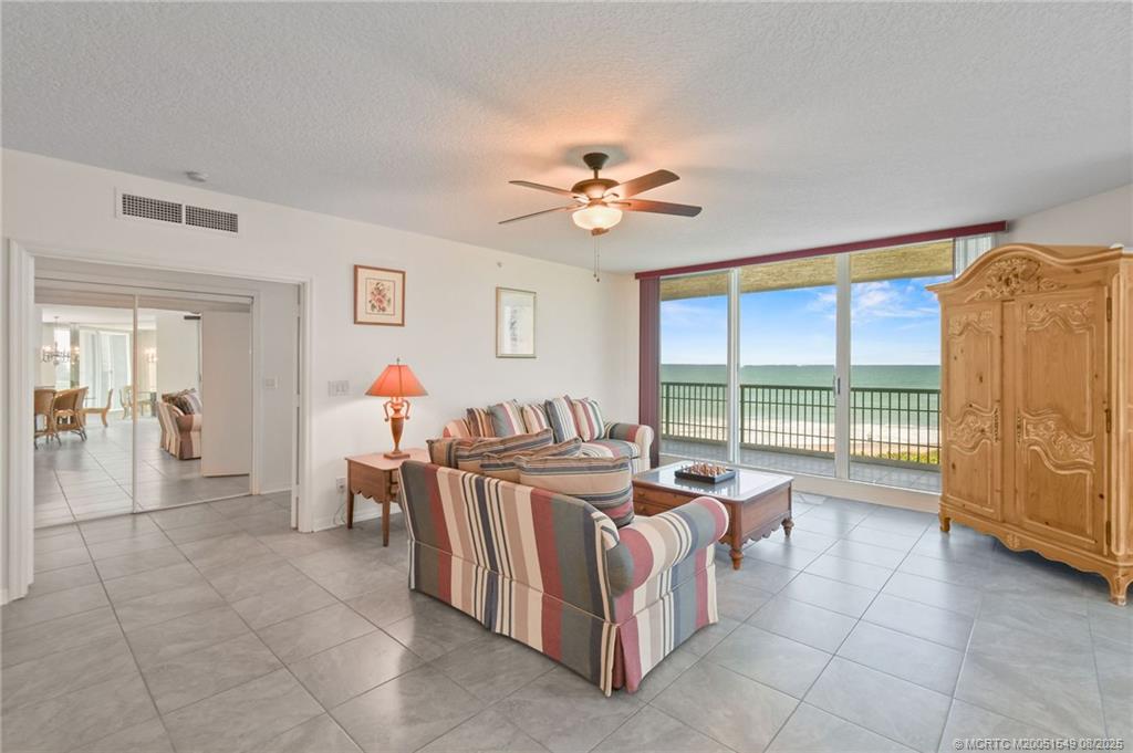 8650 South Ocean Drive, Unit 306 Jensen Beach, FL 34957 - Photo 7 of 51 a bed room with furniture and a large window