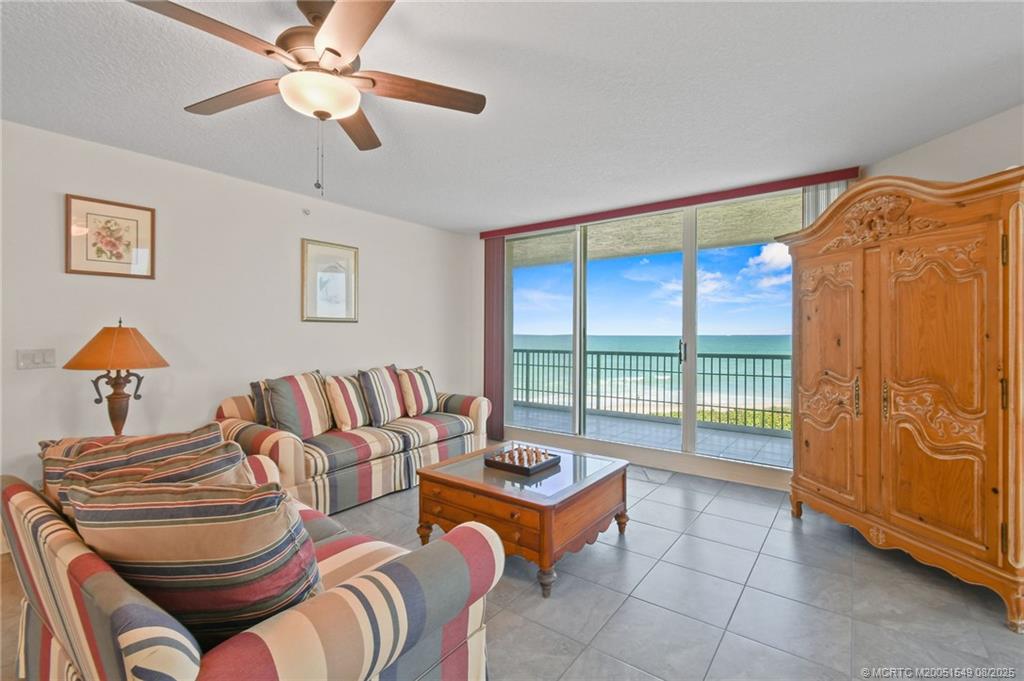8650 South Ocean Drive, Unit 306 Jensen Beach, FL 34957 - Photo 8 of 51 a living room with furniture and a window