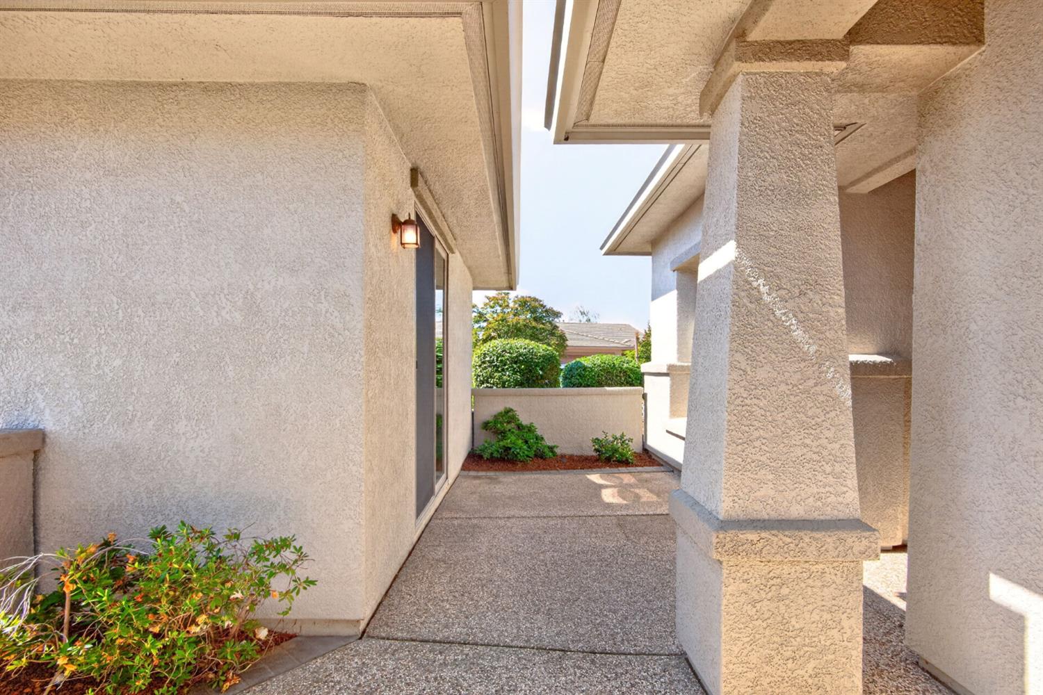 1260 Freschi Lane Lincoln, CA 95648 - Photo 11 of 60 a view of a pathway of a house with potted plants