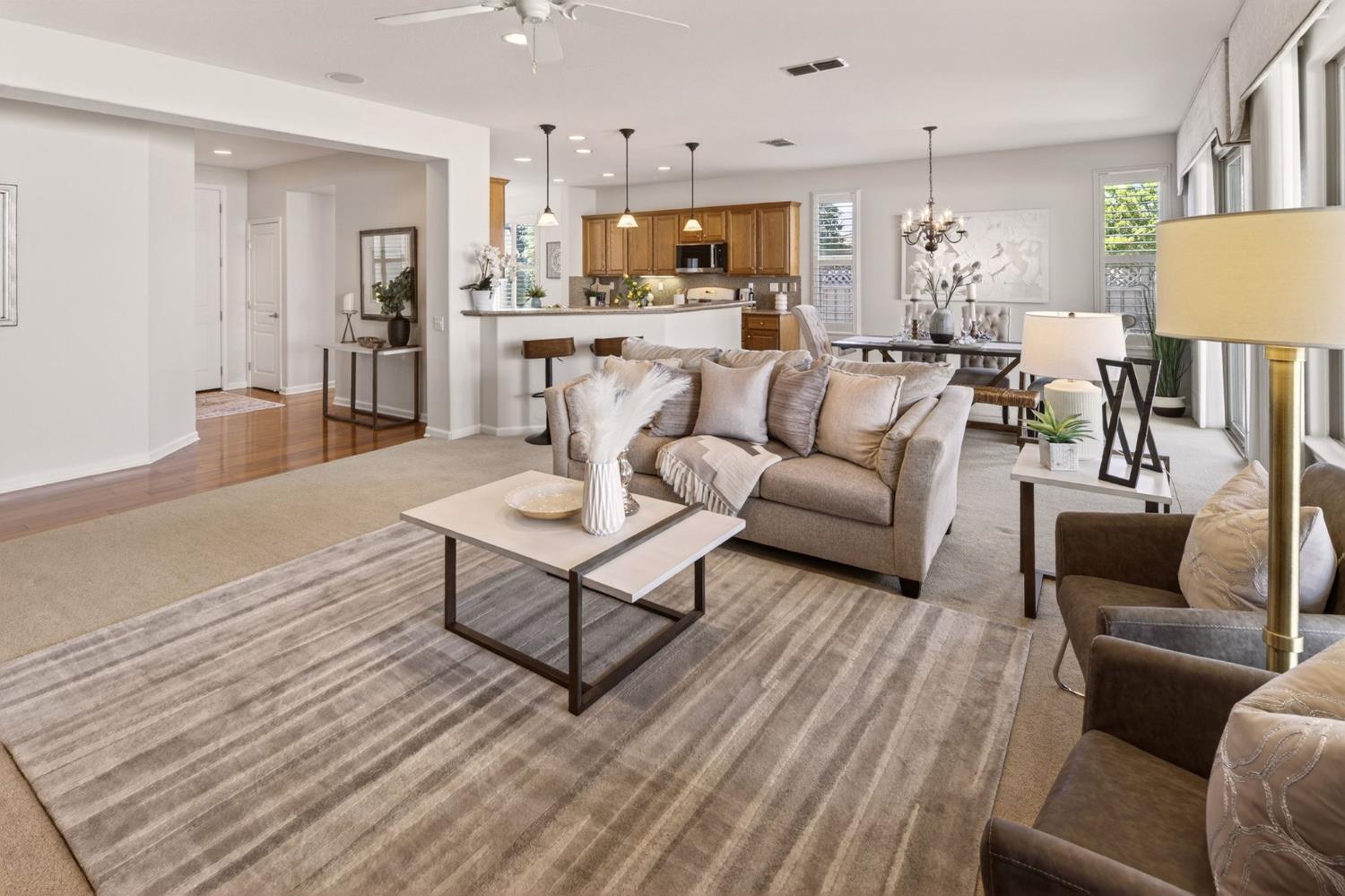 1260 Freschi Lane Lincoln, CA 95648 - Photo 17 of 60 a living room with furniture wooden floor and a kitchen view