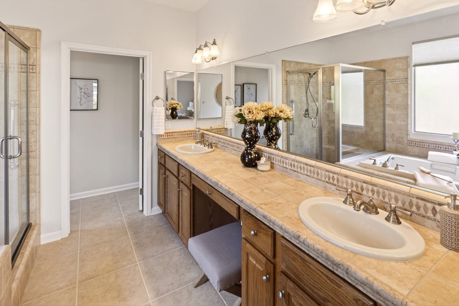 1260 Freschi Lane Lincoln, CA 95648 - Photo 27 of 60 a bathroom with a sink double vanity and a mirror
