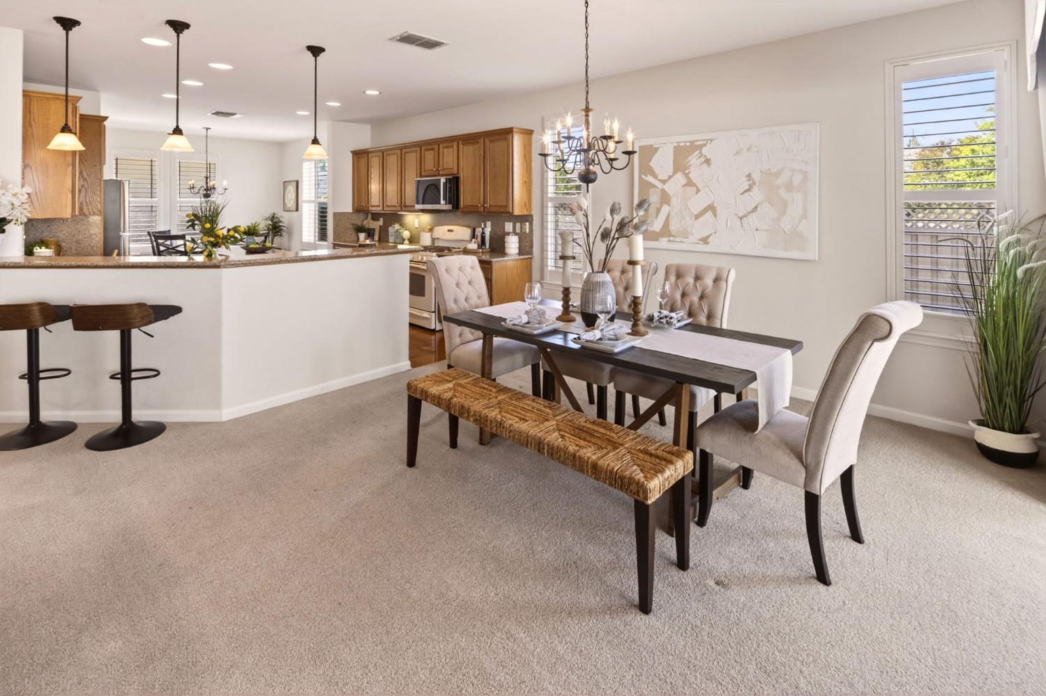 1260 Freschi Lane Lincoln, CA 95648 - Photo 3 of 60 a view of a dining room with furniture and a chandelier