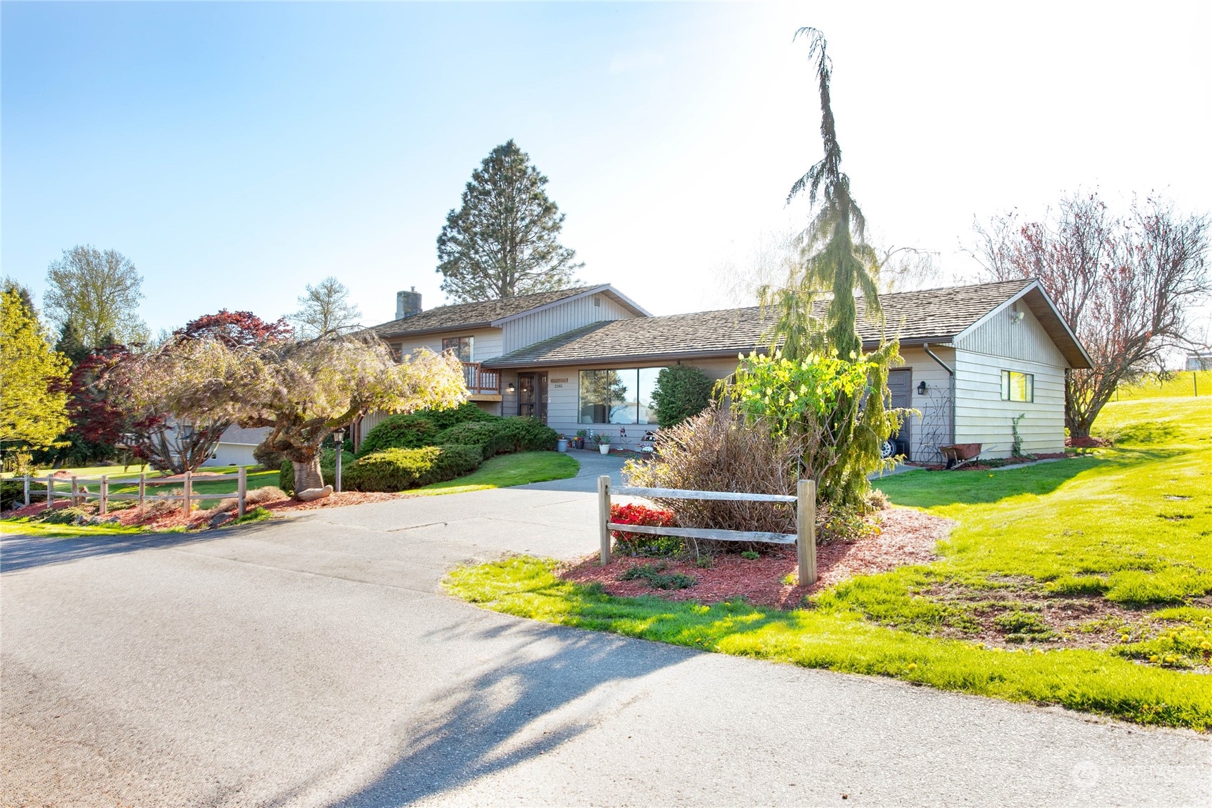 2585 Mountain View Road Ferndale, WA 98248 - Photo 2 of 40 a front view of house with yard street and trees in the background