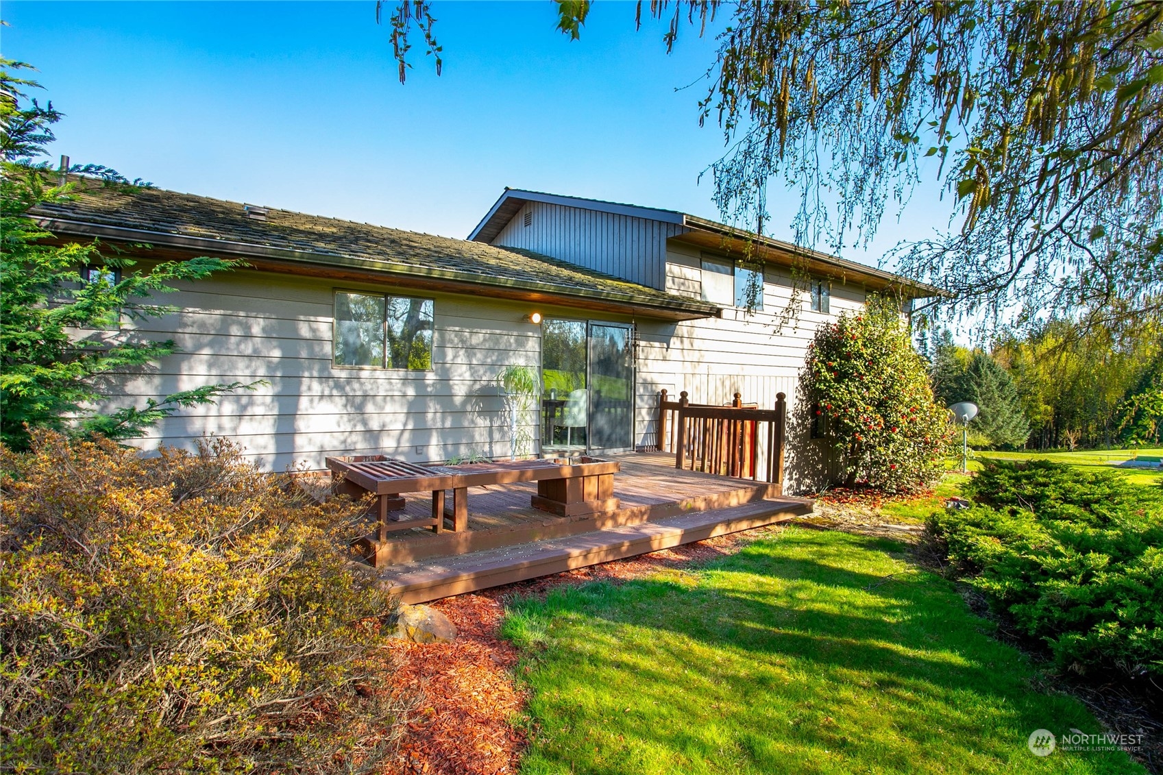2585 Mountain View Road Ferndale, WA 98248 - Photo 36 of 40 a backyard of a house with table and chairs