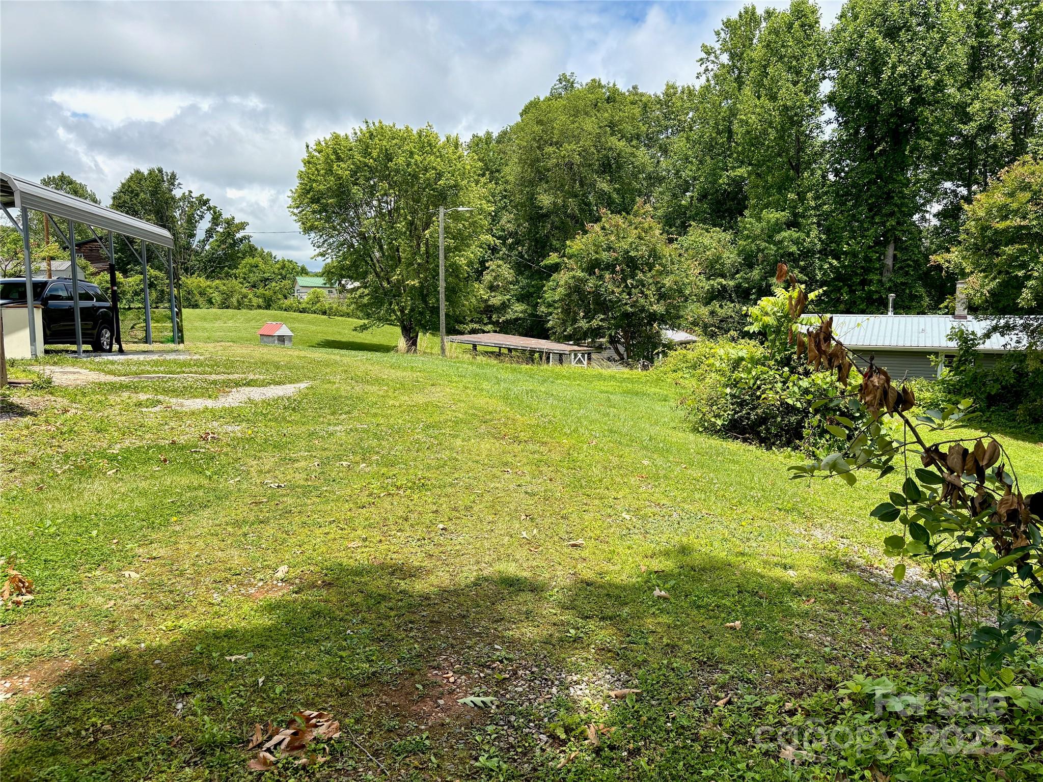 78 Moffitt Hill Church Road Old Fort, NC 28762 - Photo 11 of 37 a view of a garden with trees