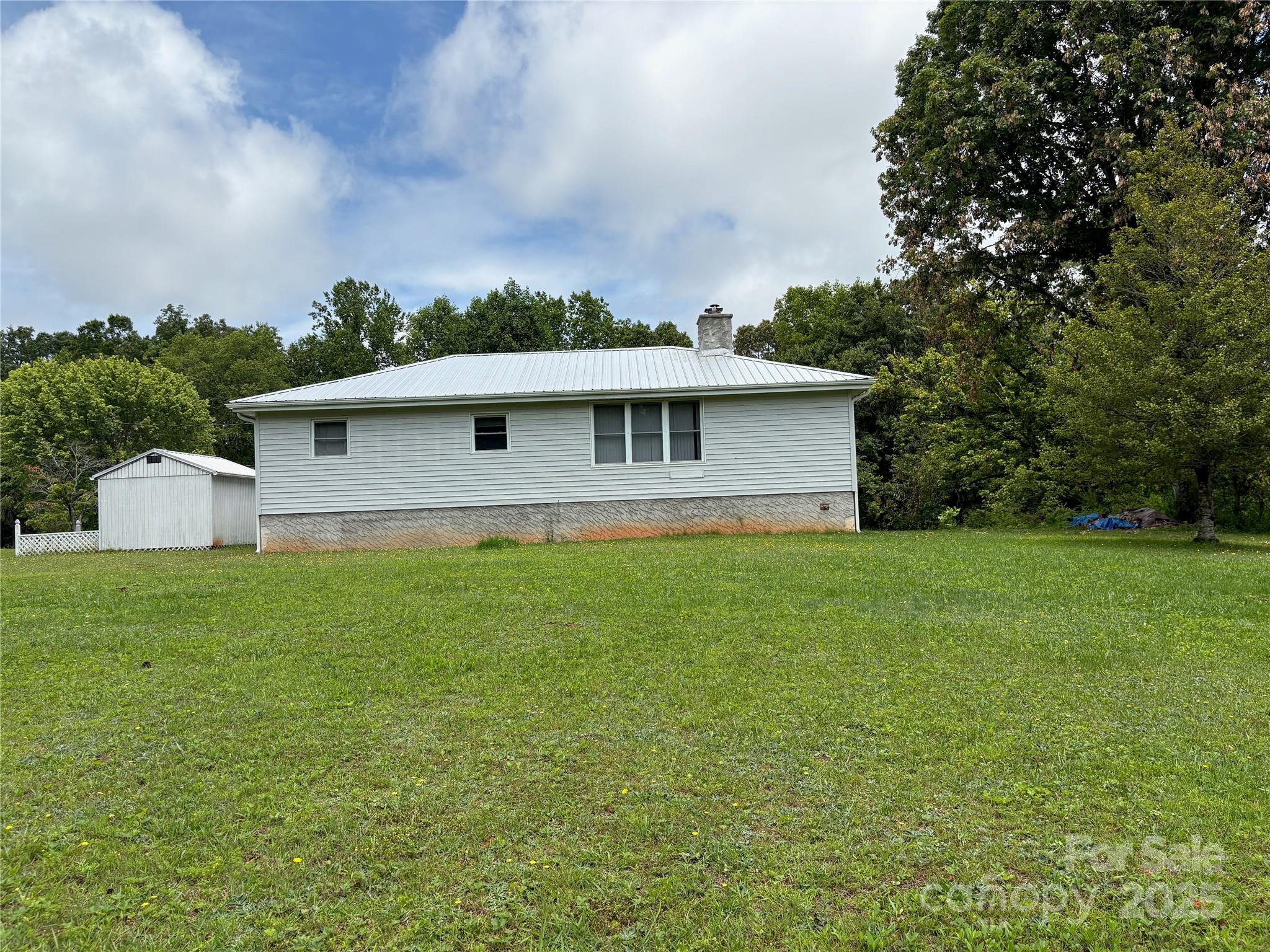 78 Moffitt Hill Church Road Old Fort, NC 28762 - Photo 2 of 37 a front view of a house with a yard