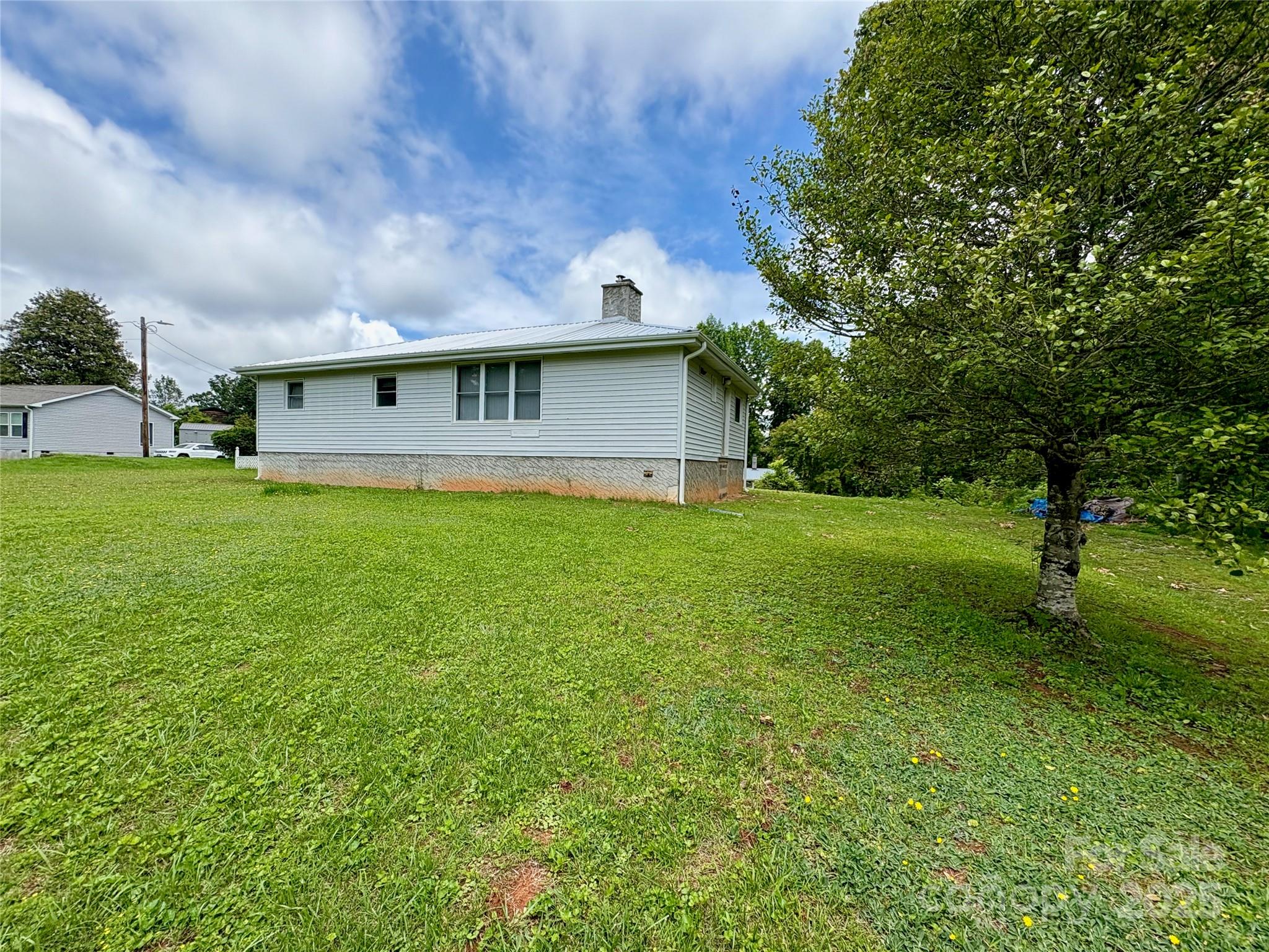 78 Moffitt Hill Church Road Old Fort, NC 28762 - Photo 21 of 37 a view of a house with a yard