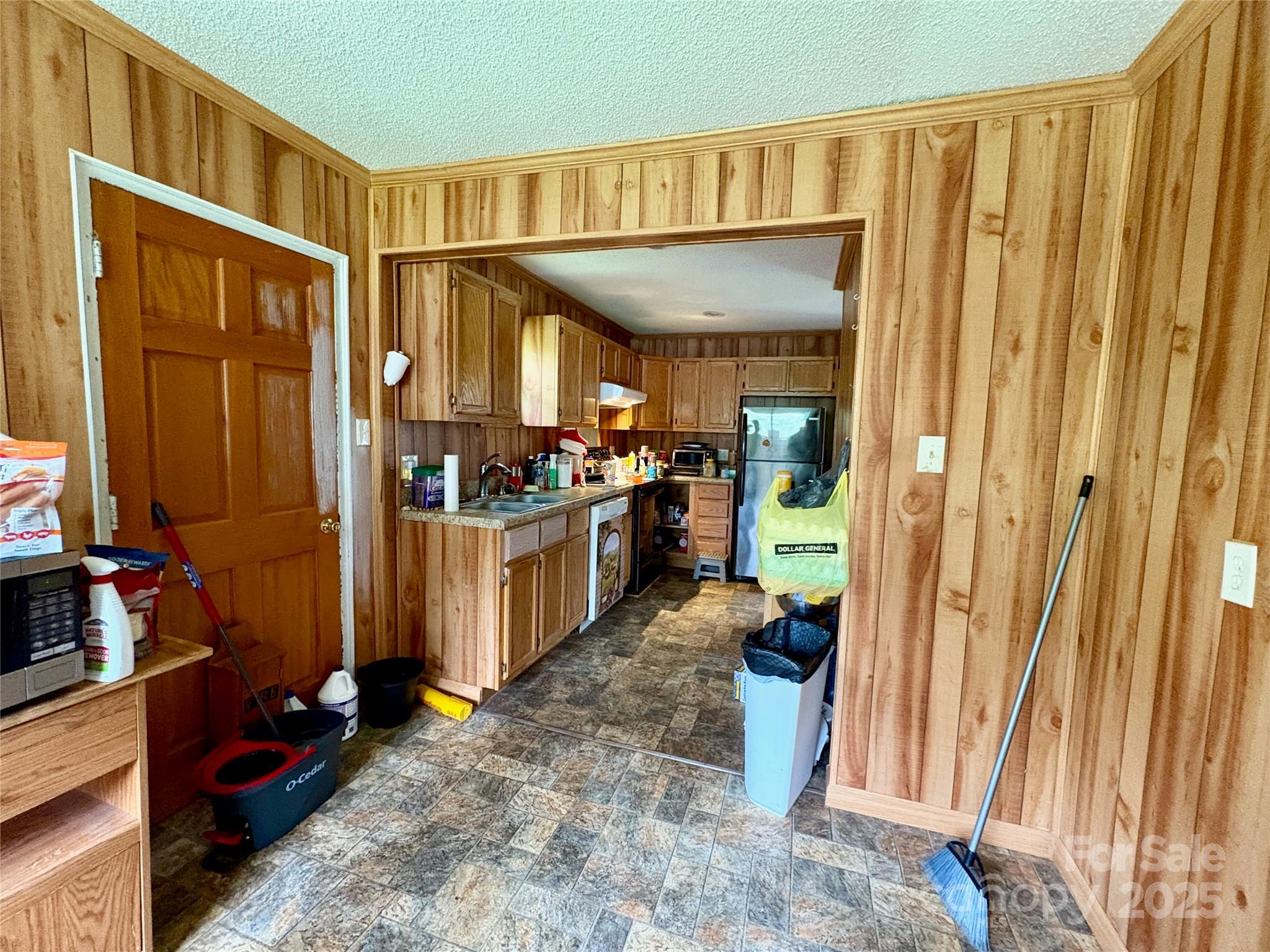 78 Moffitt Hill Church Road Old Fort, NC 28762 - Photo 27 of 37 a kitchen with stainless steel appliances a refrigerator and a stove