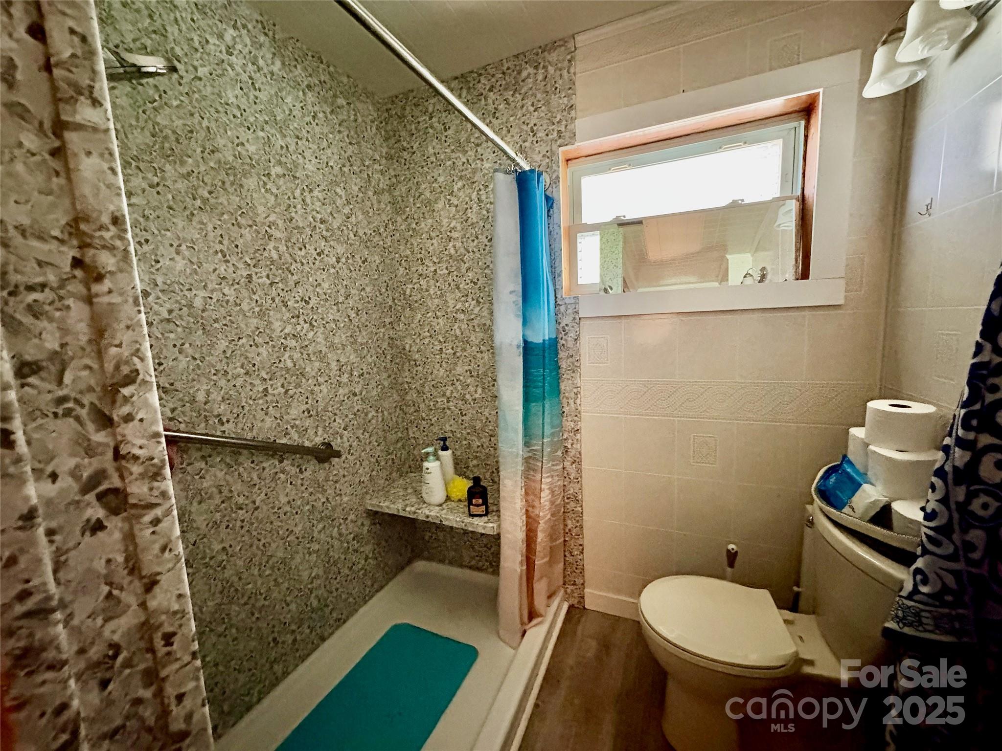 78 Moffitt Hill Church Road Old Fort, NC 28762 - Photo 30 of 37 a bathroom with a sink toilet and mirror