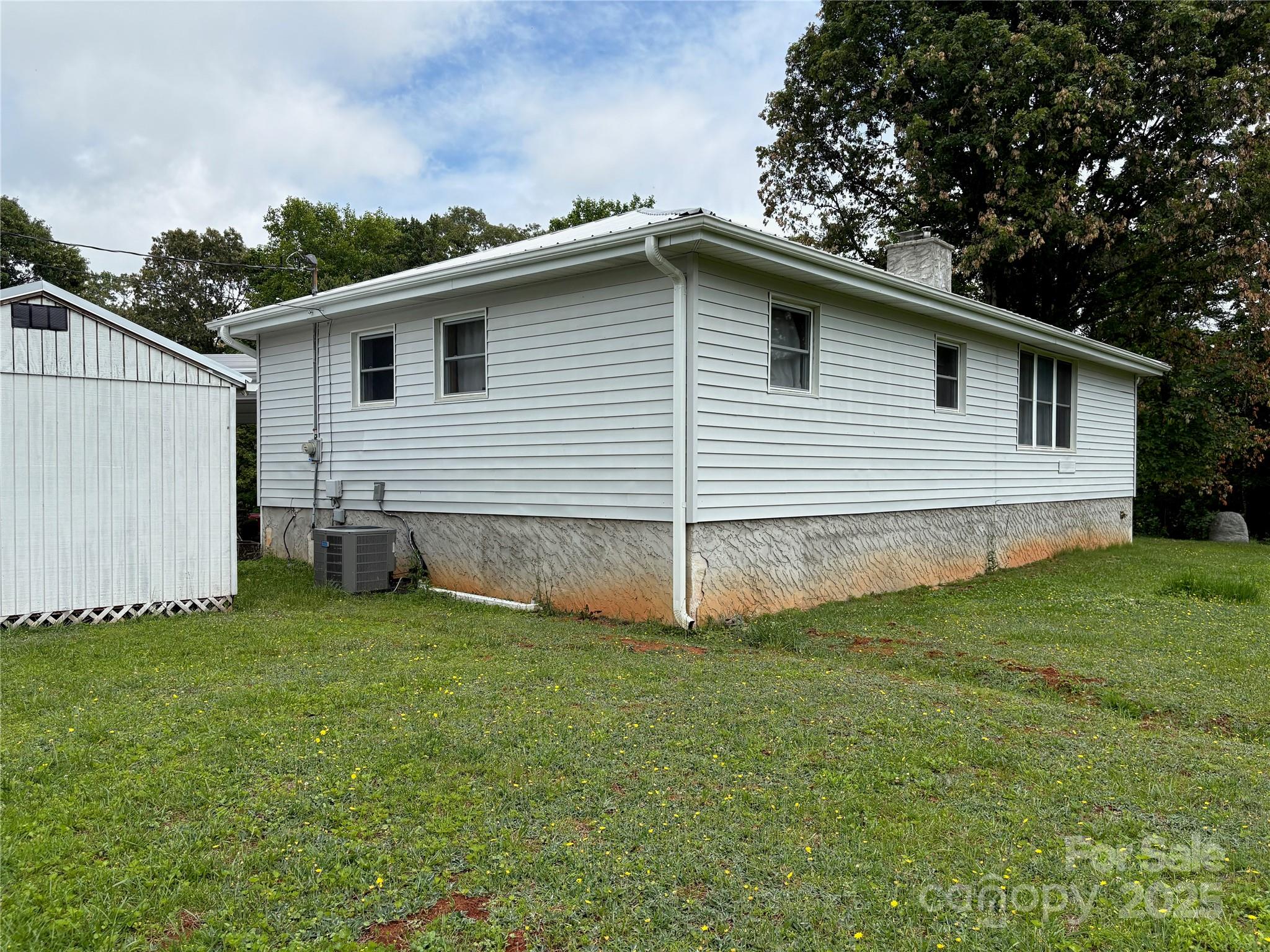 78 Moffitt Hill Church Road Old Fort, NC 28762 - Photo 4 of 37 a view of a house with a backyard
