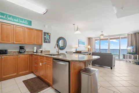 a kitchen with a sink cabinets and window