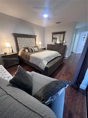 a bedroom with bed and window