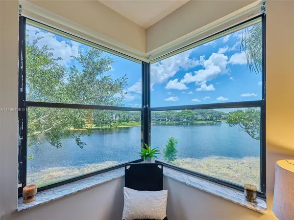 a bathroom with a sink a toilet a mirror and vanity