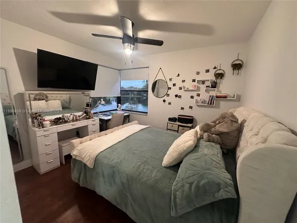 a bed room with a bed window and a couch