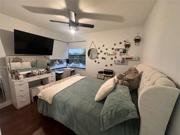 a living room with furniture and flat screen tv