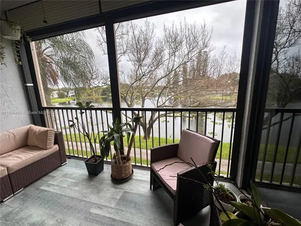 a view of balcony with furniture