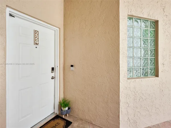 a view of an entryway with wooden floor