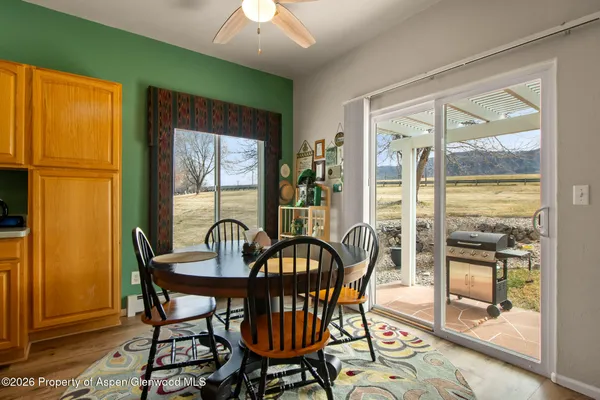 a view of a dining room with furniture window and outside view
