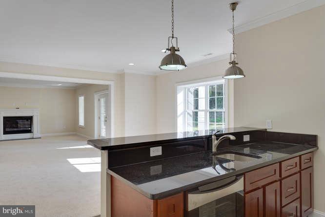 9423 Old Courthouse Road Vienna, VA 22182 - Photo 26 of 30 a kitchen with granite countertop a sink and a stove