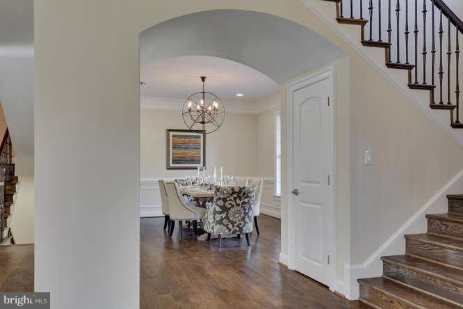 9423 Old Courthouse Road Vienna, VA 22182 - Photo 4 of 30 a view of a livingroom with the dinning room and stairs