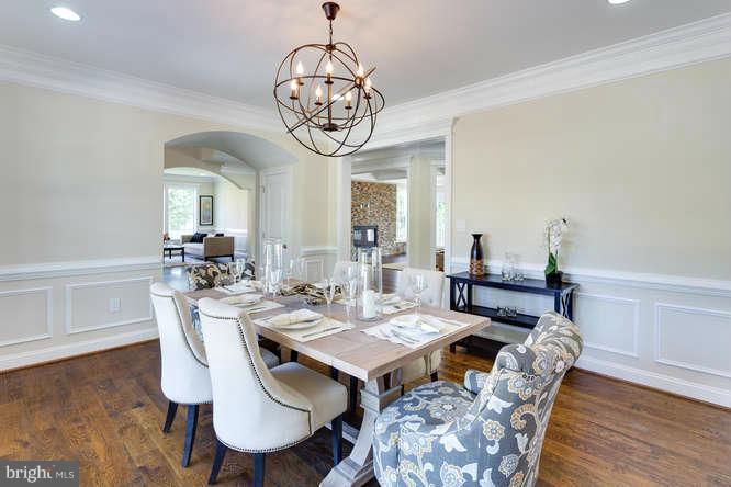 9423 Old Courthouse Road Vienna, VA 22182 - Photo 10 of 30 a view of a dining room with furniture wooden floor and chandelier