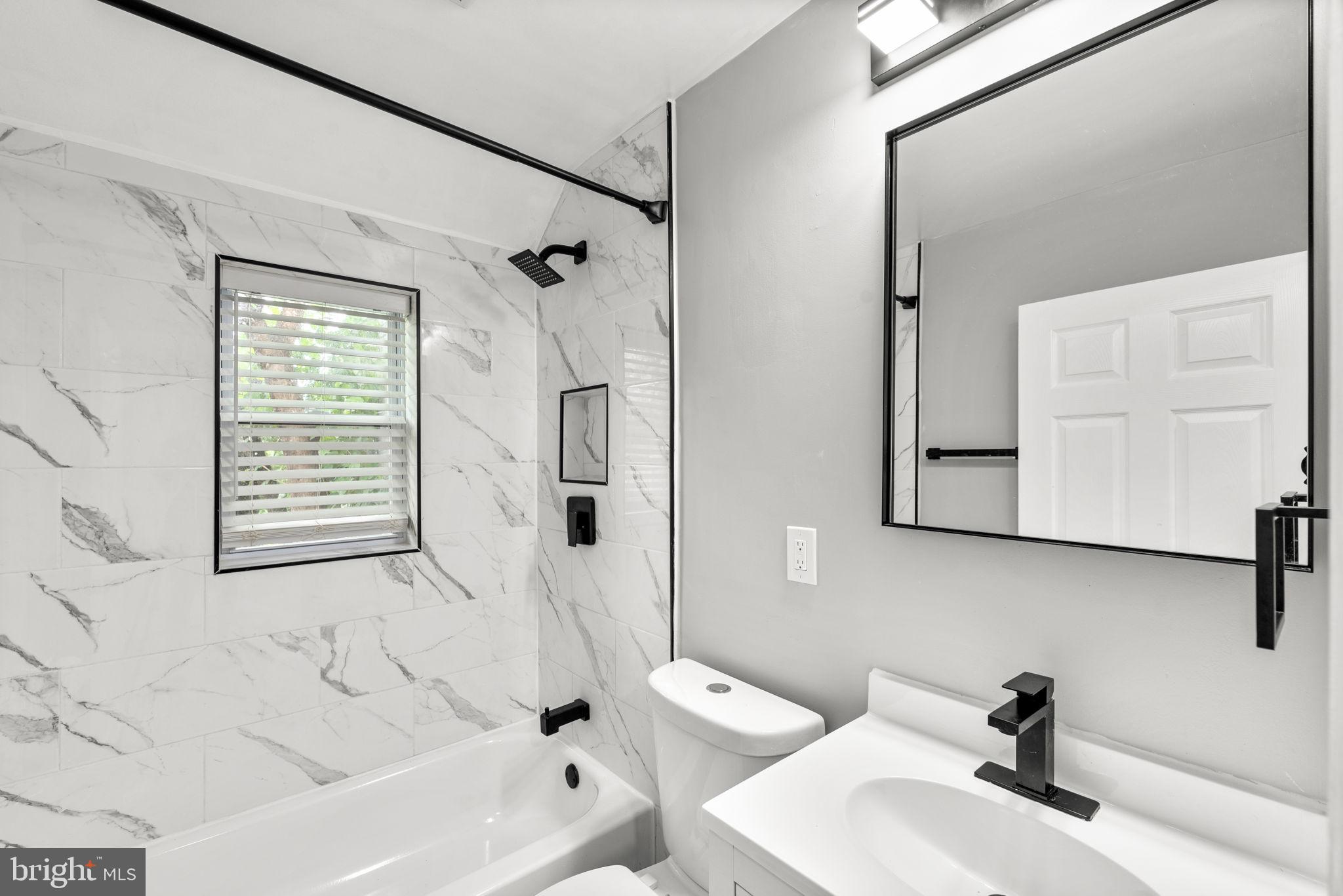 3406 Louth Road Dundalk, MD 21222 - Photo 11 of 30 a bathroom with a sink and a bathtub