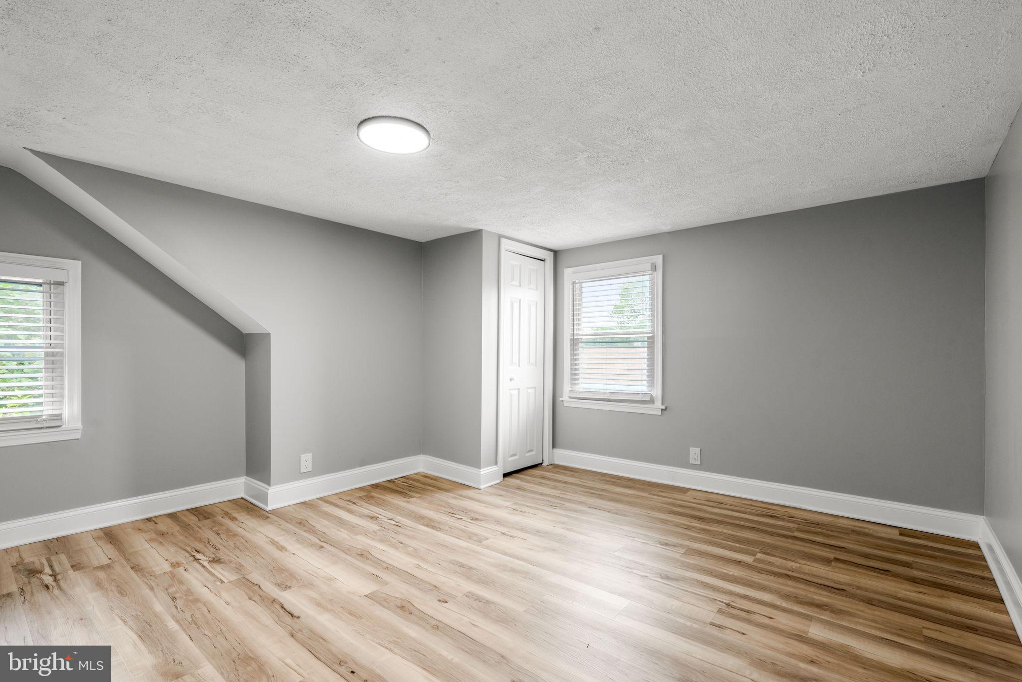 3406 Louth Road Dundalk, MD 21222 - Photo 20 of 30 a view of empty room with wooden floor and fan