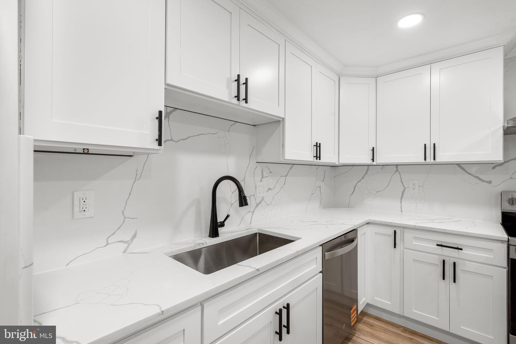 3406 Louth Road Dundalk, MD 21222 - Photo 4 of 30 a kitchen with a sink cabinets and appliances