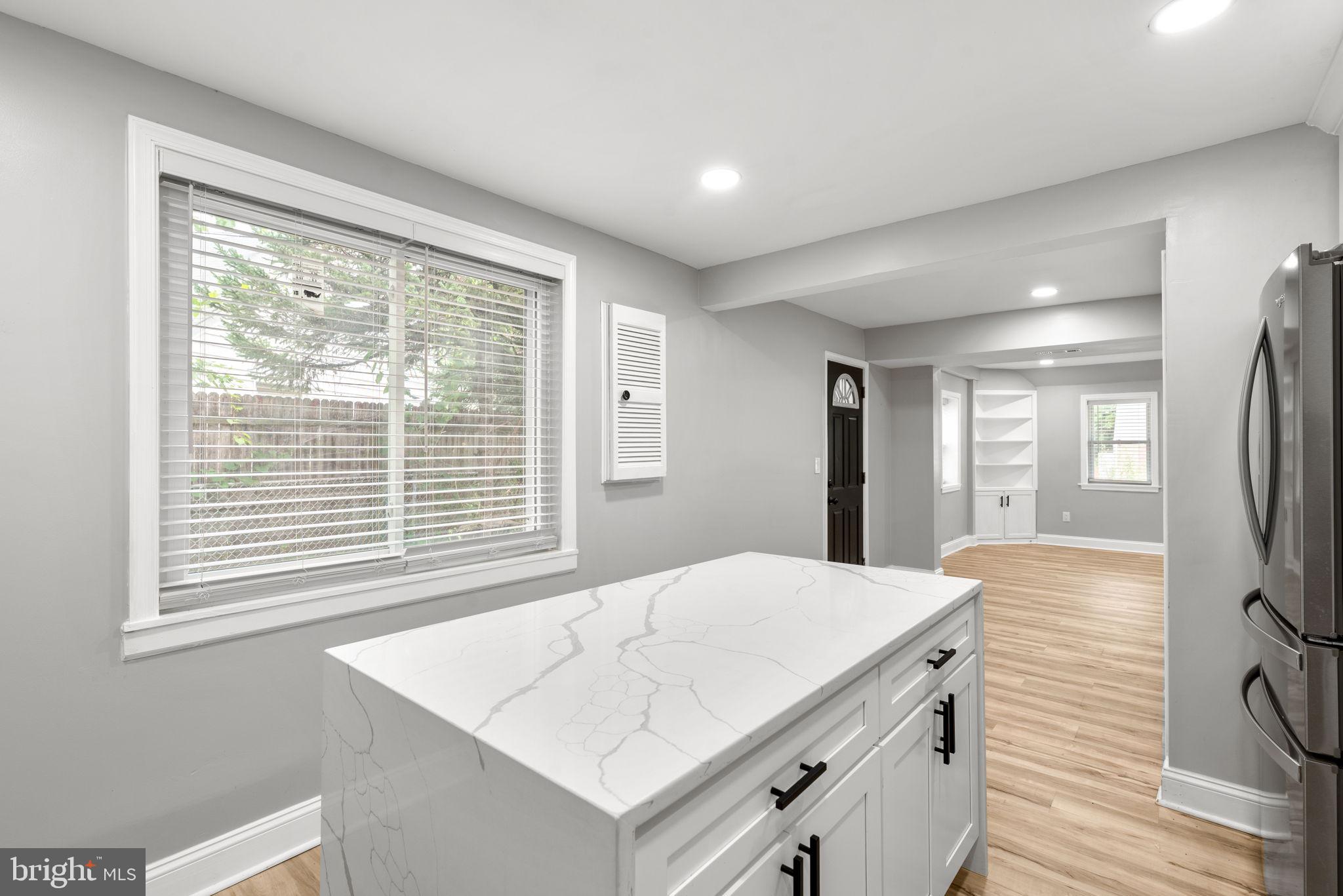 3406 Louth Road Dundalk, MD 21222 - Photo 6 of 30 a view of kitchen with granite countertop window and wooden floor