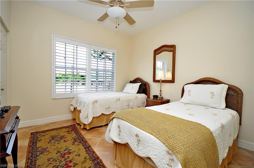 401 Bayfront Place, Unit 3201 Naples, FL 34102 - Photo 13 of 24 a bedroom with two beds and a window