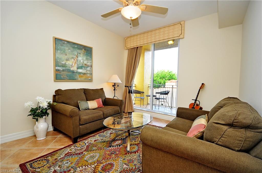401 Bayfront Place, Unit 3201 Naples, FL 34102 - Photo 14 of 24 a living room with furniture and a large window