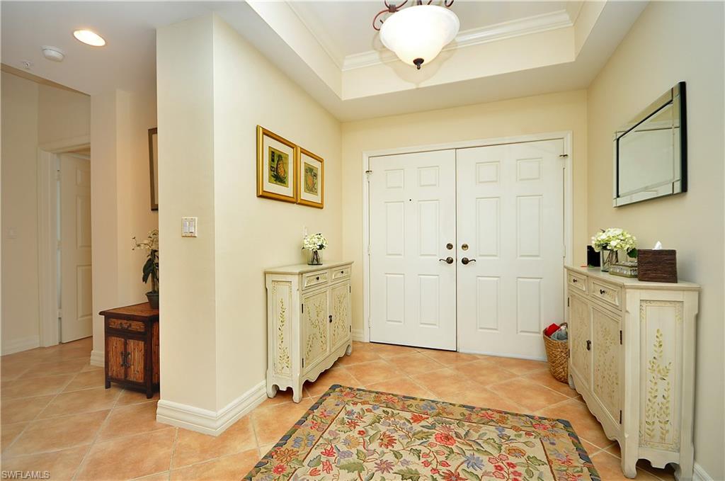401 Bayfront Place, Unit 3201 Naples, FL 34102 - Photo 9 of 24 a view of a bedroom with a bed and wooden floor