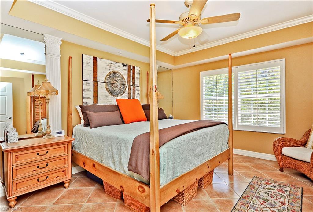 401 Bayfront Place, Unit 3201 Naples, FL 34102 - Photo 10 of 24 a bedroom with a bed and furniture