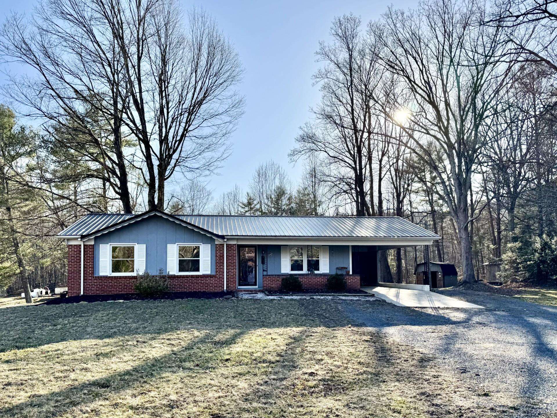 8127 Briery Branch Road Dayton, VA 22821 - Photo 1 of 23 a front view of a house with a yard and trees