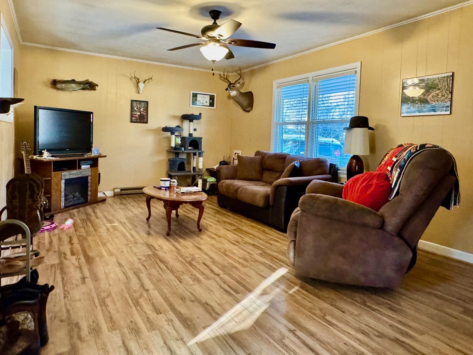 8127 Briery Branch Road Dayton, VA 22821 - Photo 2 of 23 a living room with furniture and a flat screen tv