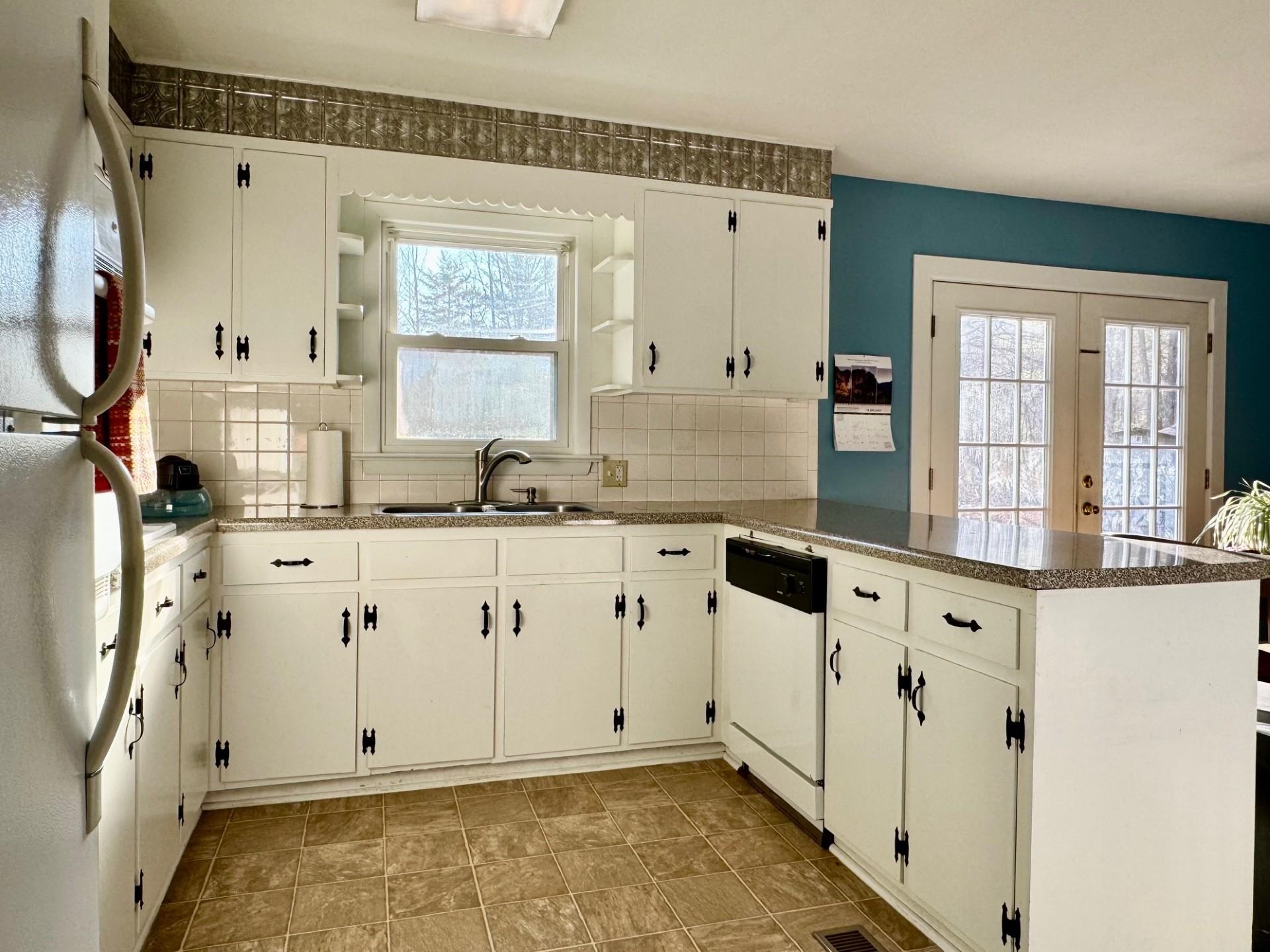 8127 Briery Branch Road Dayton, VA 22821 - Photo 3 of 23 a view of kitchen with granite countertop white cabinets and white appliances