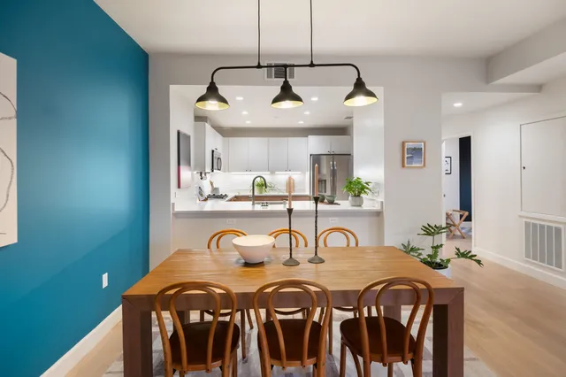 a kitchen with a sink stove and microwave