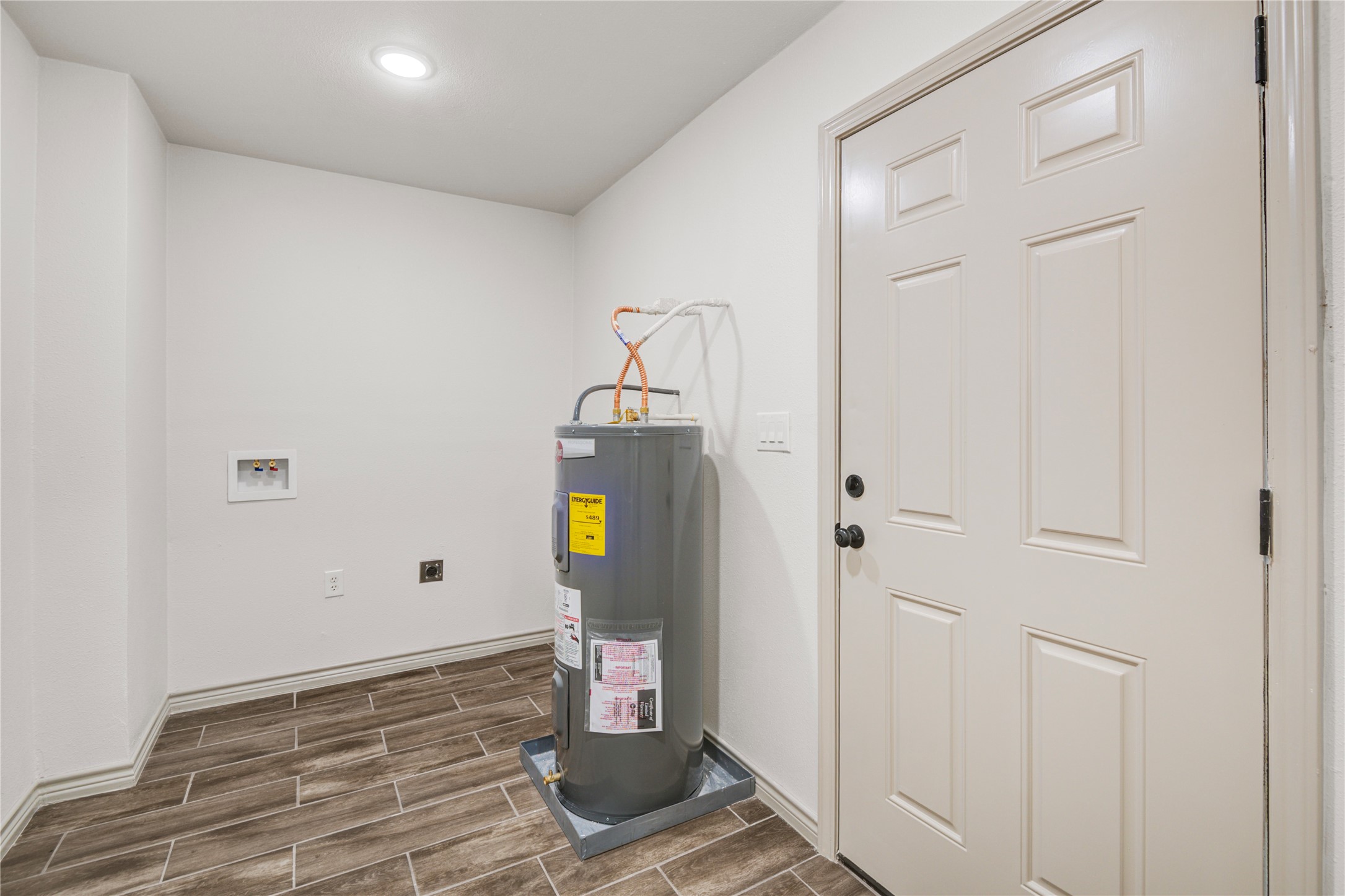 1530 West 10th Street Freeport, TX 77541 - Photo 14 of 32 a view of empty room with wooden floor