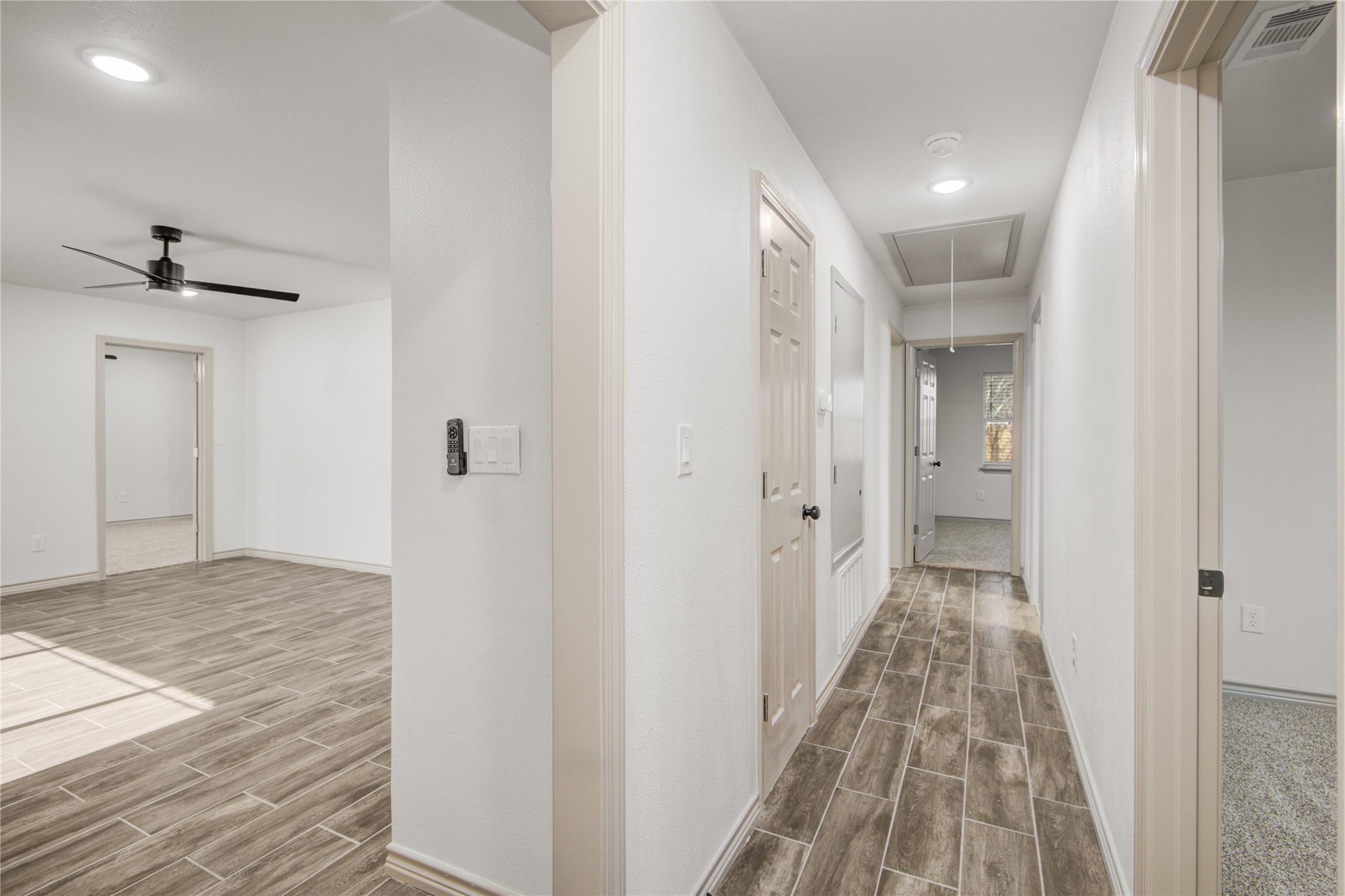 1530 West 10th Street Freeport, TX 77541 - Photo 23 of 32 a view of a hallway with a chandelier