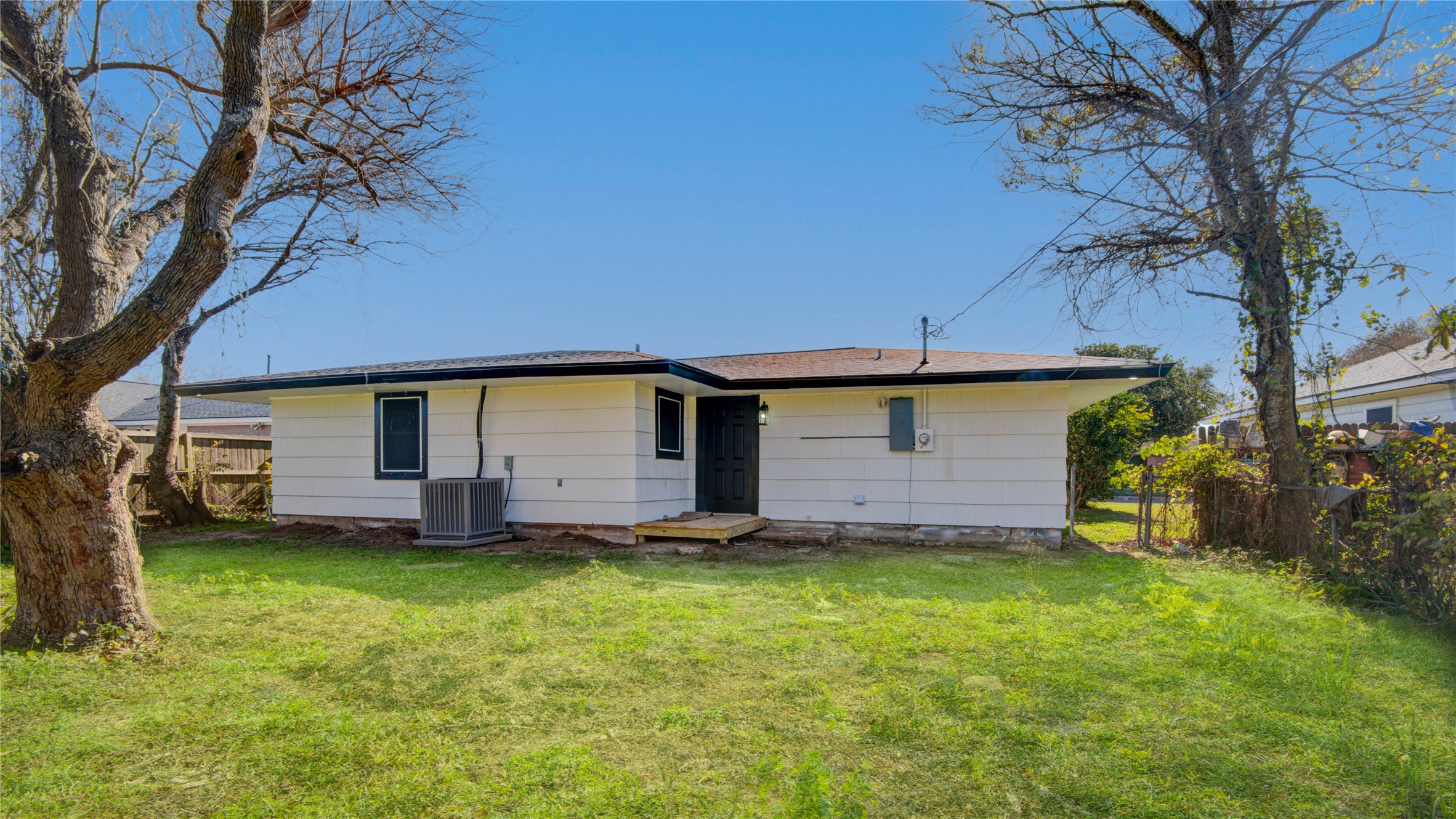 1530 West 10th Street Freeport, TX 77541 - Photo 30 of 32 a view of a house with a yard and tree