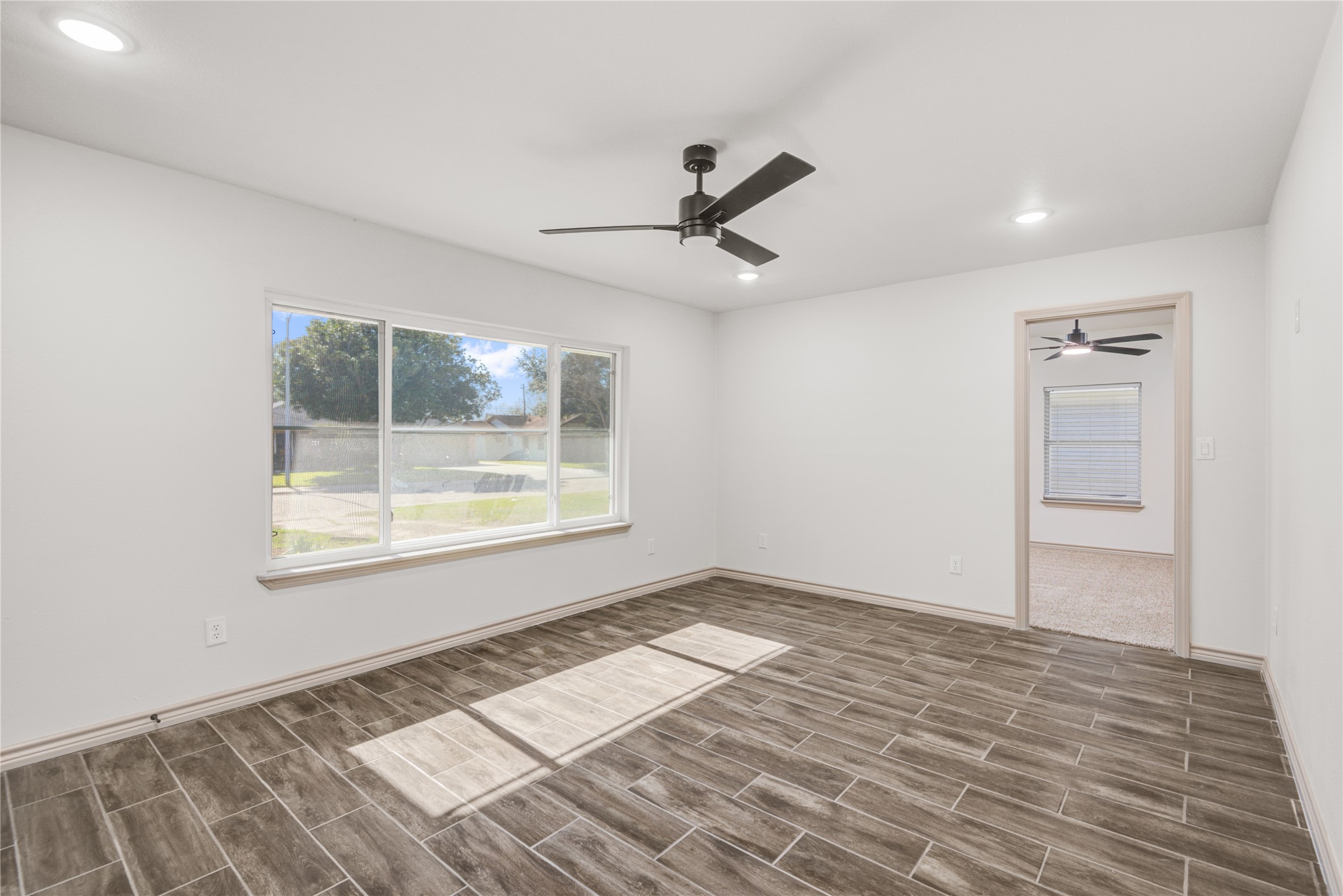 1530 West 10th Street Freeport, TX 77541 - Photo 7 of 32 a view of an empty room and window